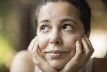 Woman With Both Hands on Her Chin