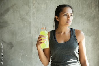 Woman with bottle of drink