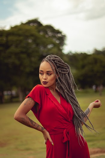 Woman With Braided Hair Wearing Red Dress