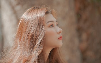 Woman With Brown Hair Looking on Her Left