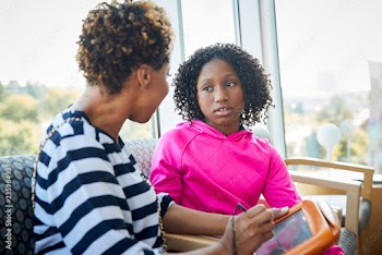 Woman with daughter in medical office