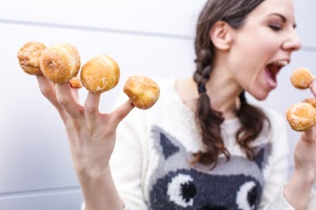 Woman with Donut Fingers Free Photo 