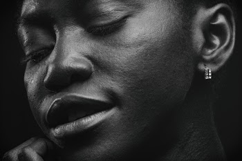 Woman With Earrings Closing Its Eyes