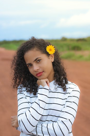 Woman With Flower on Her Top Ear