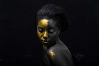 Woman With Golden Face Paint