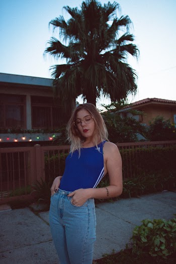 Woman With Hands Inside Her Pockets