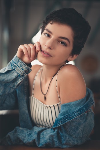 Woman With Hands on Cheeks