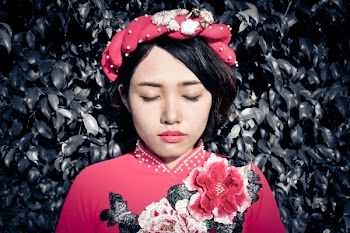 Woman With Her Eyes Closed Wearing Pink Floral Top
