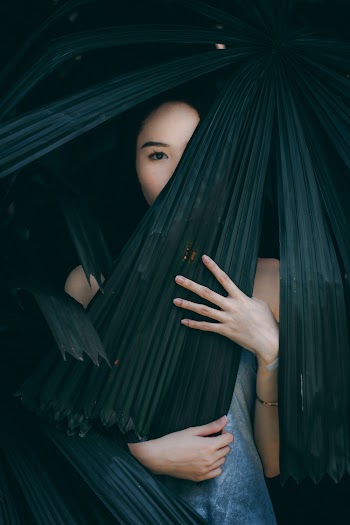 Woman With Leaves Covering Her Face
