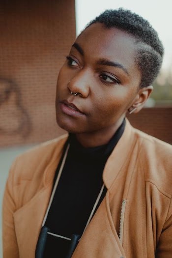 woman with nose piercing looking sideways