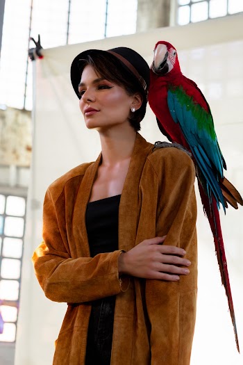 Woman With Red and Green Parrot