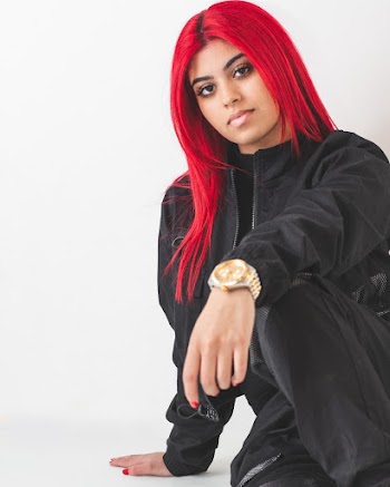 Woman with Red Hair Wearing Black Jacket