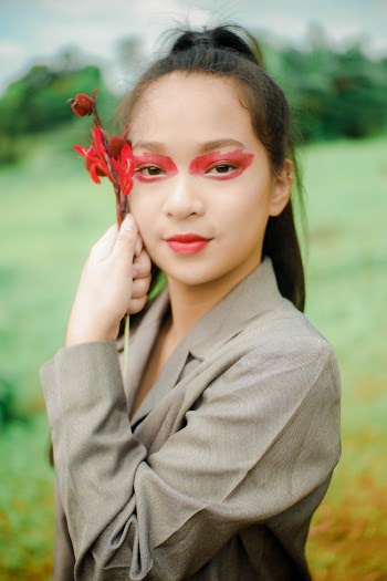 Woman with Red Paint on Her Eyes