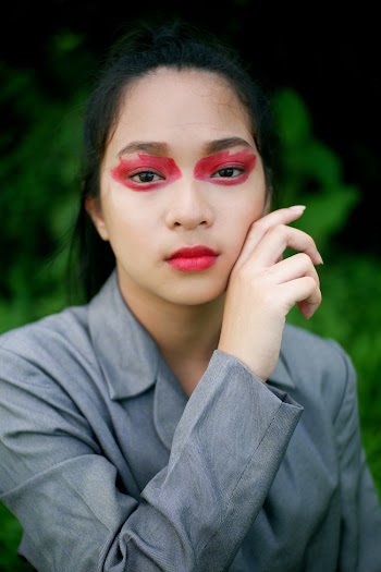 Woman with Red Paint on Her Eyes