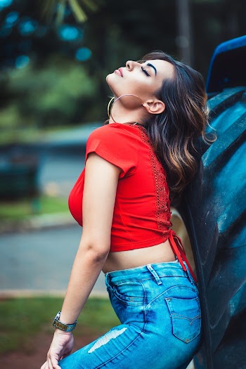 Woman With Red Skirt and Blue Denim Jeans