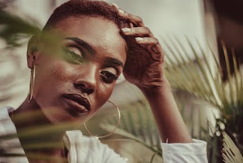 Woman with Short Hair Holding Her Head