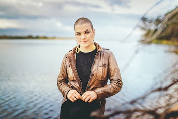 Woman With Short Hair Wearing Brown Leather Jacket