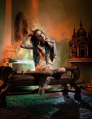 Woman With Skin Tattoo Wearing Brown Antlers