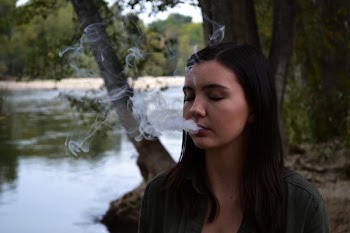 Woman With Smoke Coming Out from Mouth