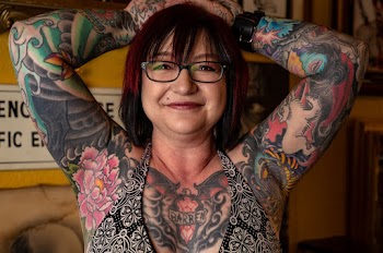 Woman With Tattoo Covered Body Wearing Bra