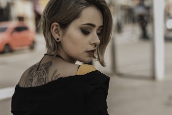 Woman With Tattoo On Her Back