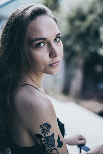 Woman With Tattoo on Shoulder