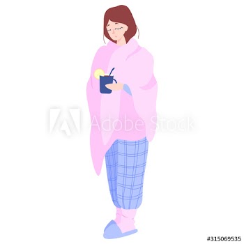 Woman wrapped in a warm blanket