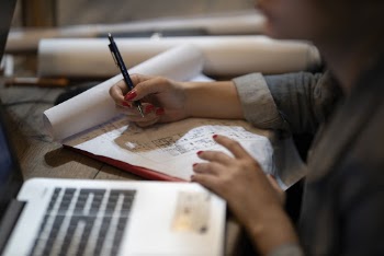 Woman Writing on Paper