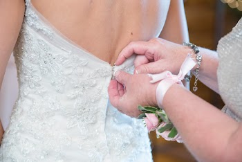 Woman Zips Wedding Dress