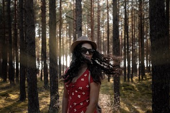 WomanWearing A Fedora Hat And Red Dress