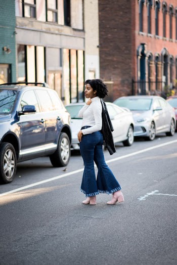 Women's in White Long-sleeved Top and Blue Flared Jeans