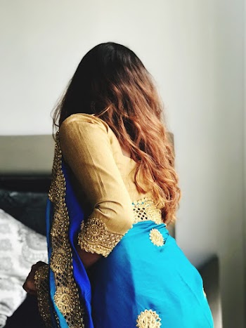 Women's wearing  a brown and blue traditional Indian dress