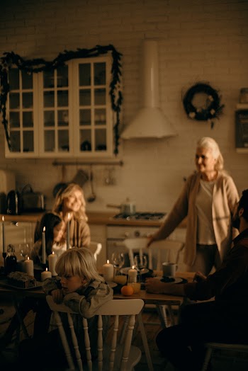 Women and Child Facing Dining Table