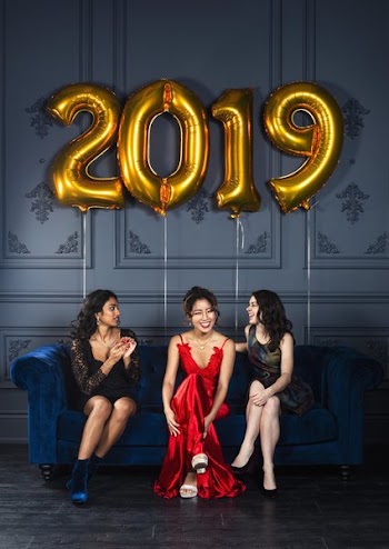 Women Chatting On Blue Velvet Couch