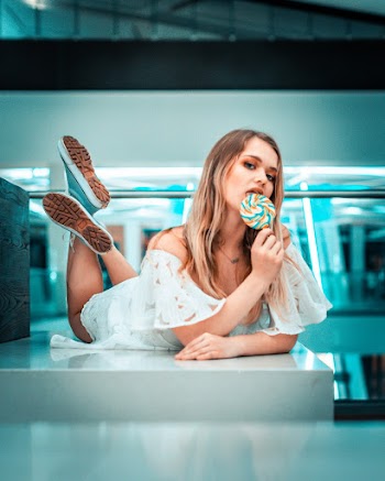 Women Eating A Lollipop 