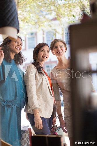 Women friends window shopping