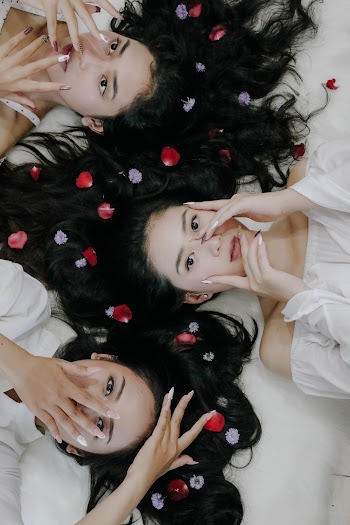 Women Holding Their Facces