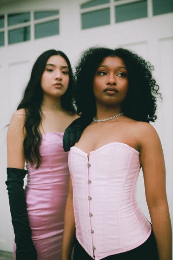 Women in Pink Outfits Posing Together · Free Stock Photo