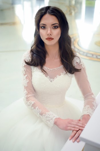 Women in White Long-sleeved Bridal Gown