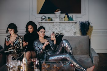 Women Sitting on Sofa