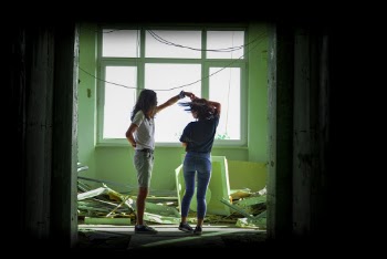 Women Standing Beside Another Woman