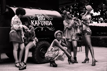 Women Standing Near the Big Kafunda Truck