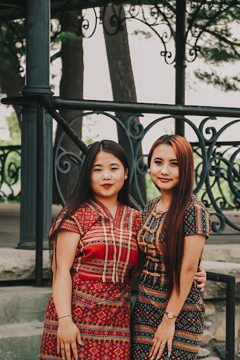 Women Standing Next to Each Other