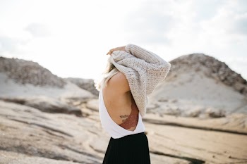 Women Taking Off knitted sweater