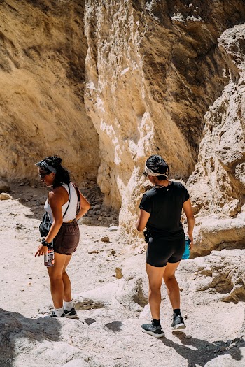 Women Walking Near Rocks