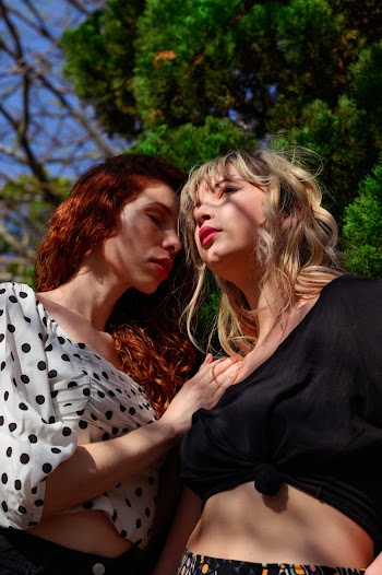 Women Wearing Black Crop-top Beside Woman