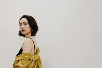 Women Wearing Black Top Shows Off Her Shoulder