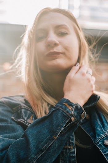 Women Wearing Blue Denim Jacket