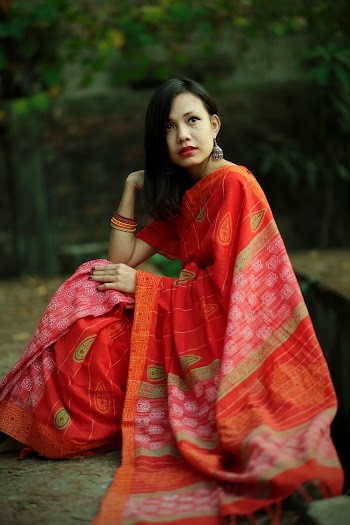 Women Wearing Red and Orange Dress Close-up Photography