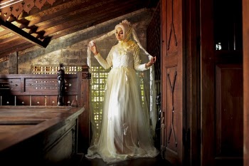 Women Wearing White Long-sleeved Dress Near Brown Wooden Door
